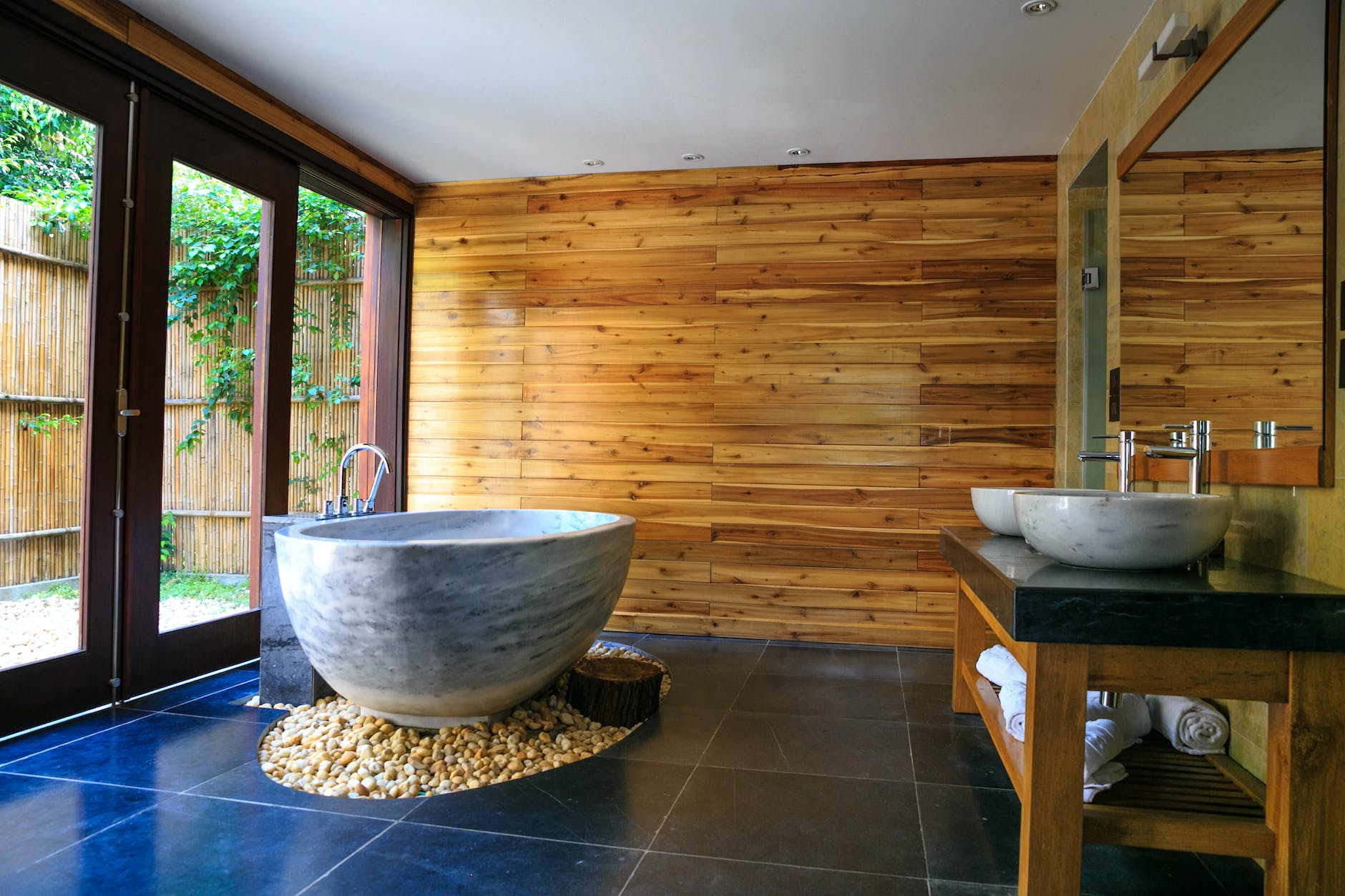 round white and gray ceramic bathtub inside brown room